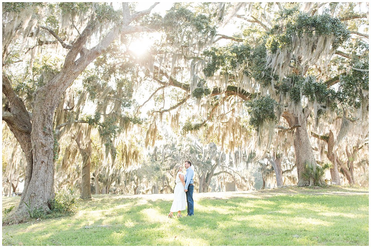 couple under huge live oaks in savannah