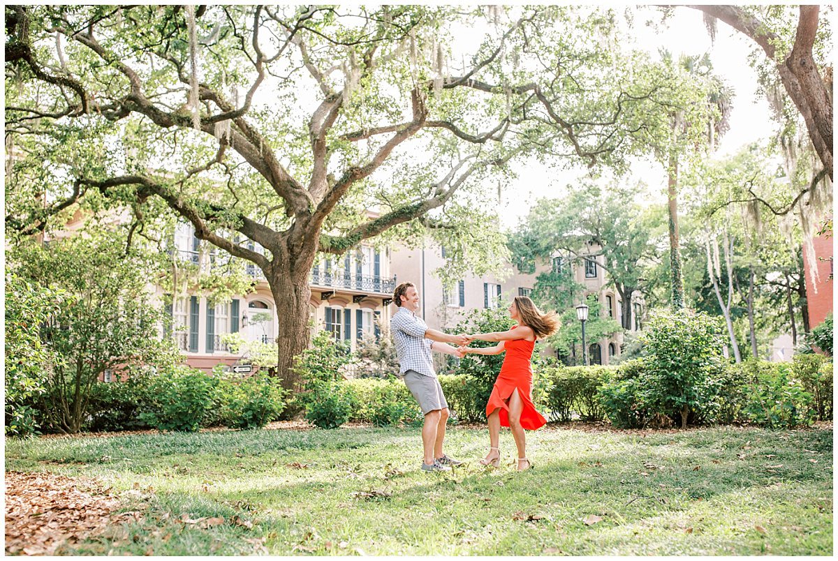 couple dancing in moneterey square under mossy oak trees